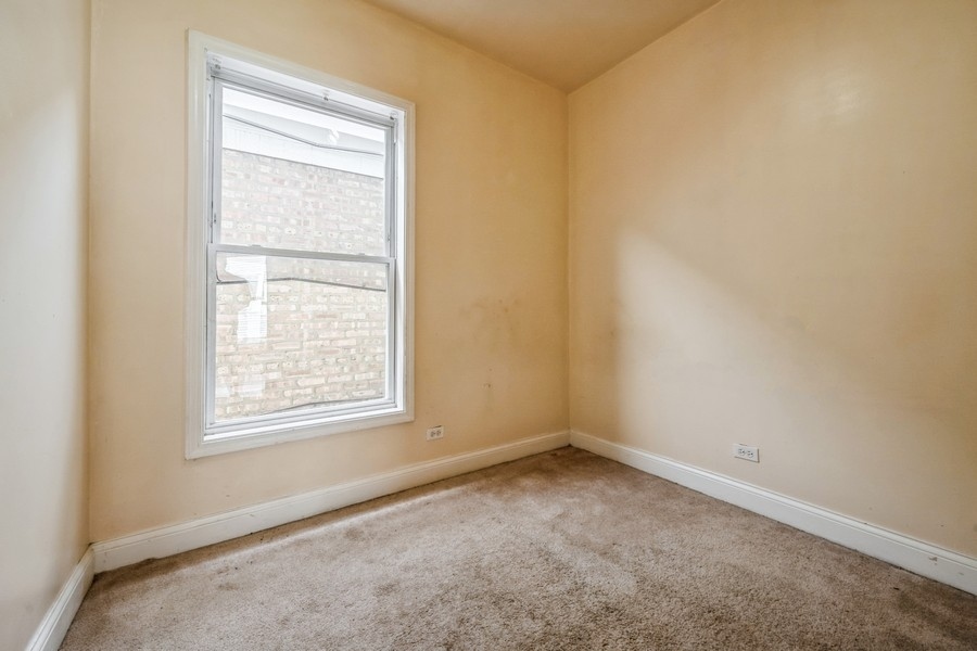 2139 North Kenneth Avenue Chicago, IL 60639 - Photo 11 of 21 an empty room with a window