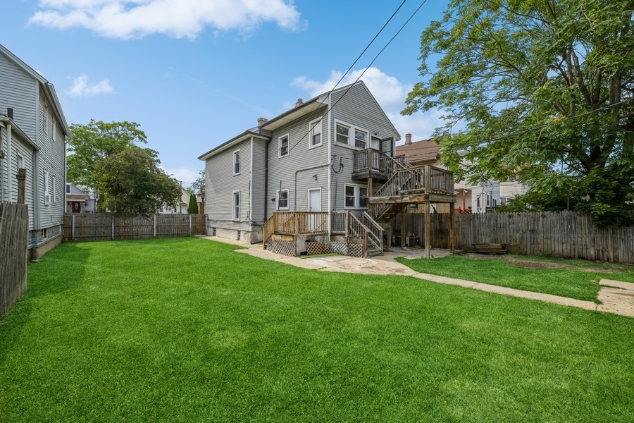 2139 North Kenneth Avenue Chicago, IL 60639 - Photo 20 of 21 a front view of a house with garden