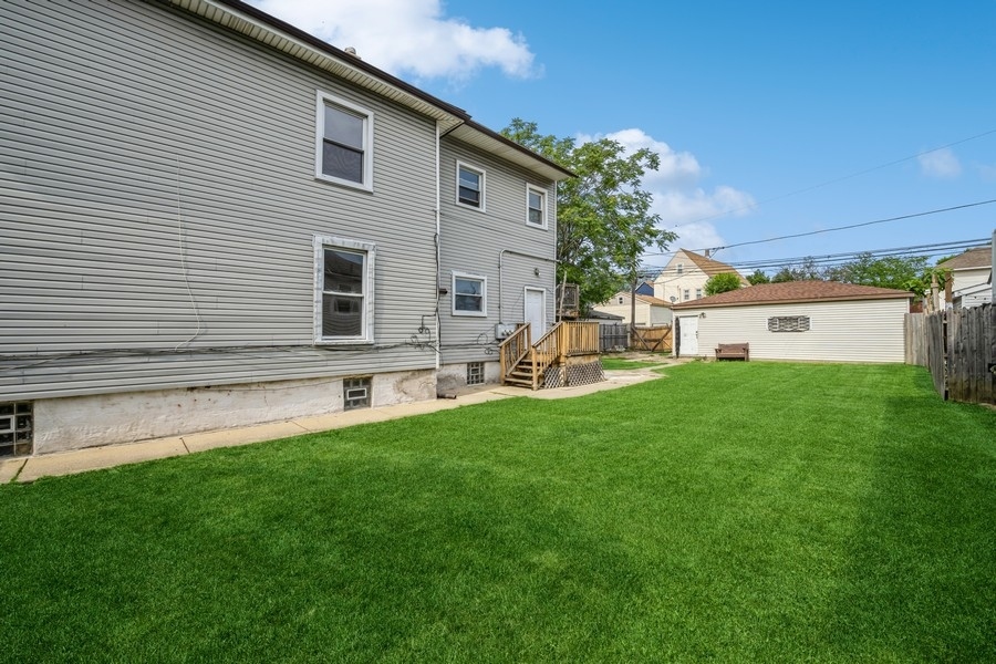 2139 North Kenneth Avenue Chicago, IL 60639 - Photo 21 of 21 a view of a house with a backyard
