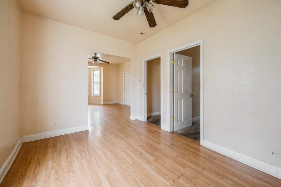 2139 North Kenneth Avenue Chicago, IL 60639 - Photo 5 of 21 a view of empty room with wooden floor