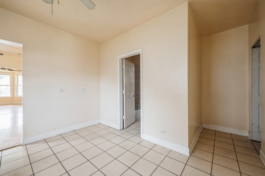 2139 North Kenneth Avenue Chicago, IL 60639 - Photo 8 of 21 a view of an empty room and window