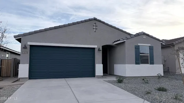 a view of a kitchen with a refrigerator a microwave and a stove
