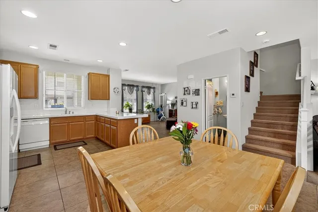 a kitchen with stainless steel appliances kitchen island granite countertop a sink and cabinets
