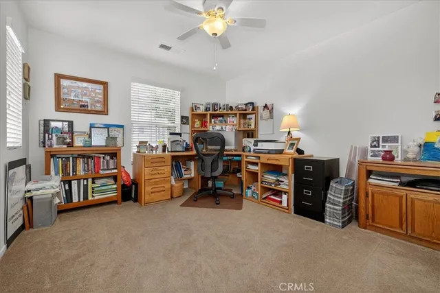a view of a workspace with furniture and toys