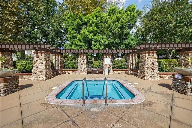a view of swimming pool with patio
