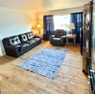 a living room with furniture and a rug