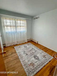an empty room with wooden floor