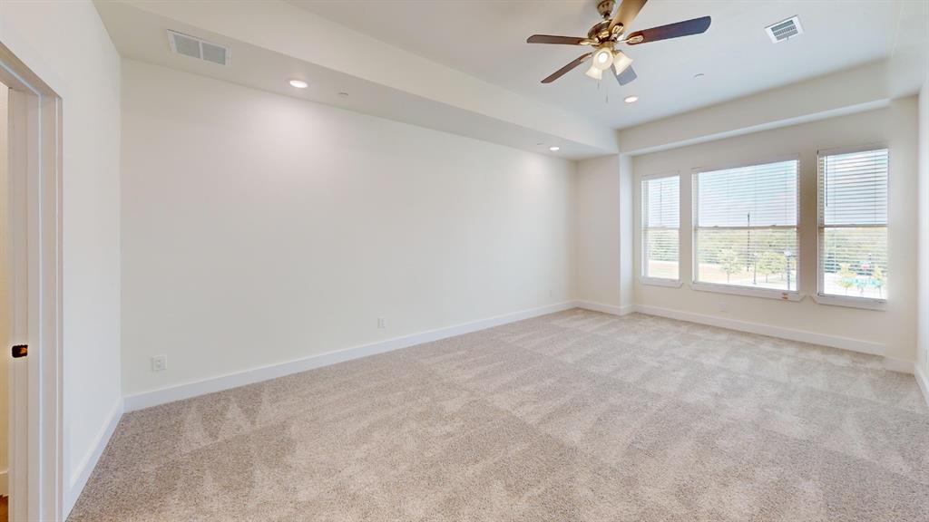 373 Buck Ridge Drive Frisco, TX 75068 - Photo 10 of 24 Recessed lighting, ceiling fan, three large windows with horizontal blinds, and neutral carpet flooring
