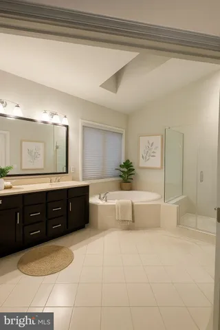 a spacious bathroom with a tub sink and mirror