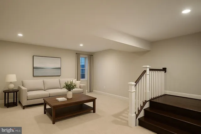 a living room with furniture and a stair
