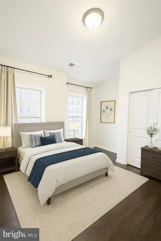 a spacious bedroom with a large bed and a window