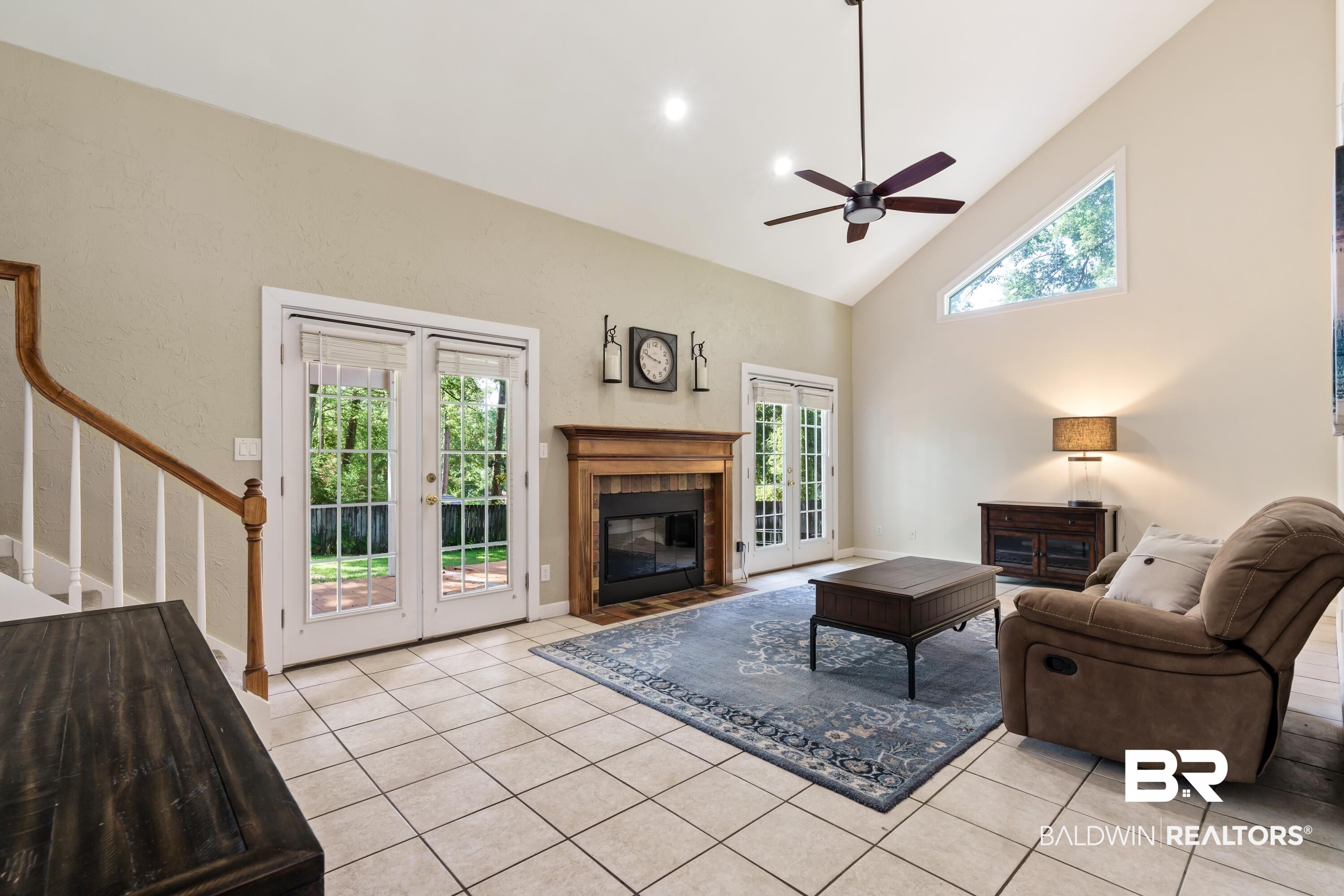104 Hope Drive Daphne, AL 36526 - Photo 10 of 40 vaulted ceilings, electric insert fireplace and double french doors to patio