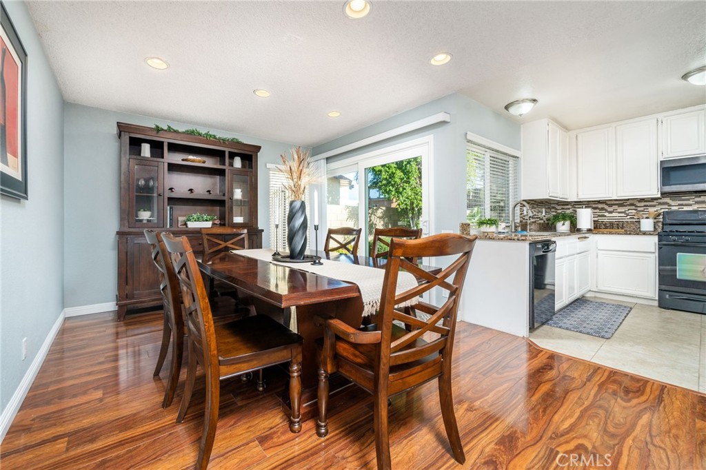 9121 Helms Avenue Rancho Cucamonga, CA 91730 - Photo 14 of 43 a dining room with furniture and window
