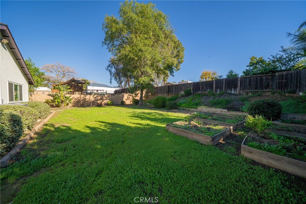9121 Helms Avenue Rancho Cucamonga, CA 91730 - Photo 27 of 43 a view of a backyard with a garden