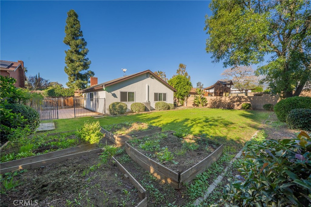 9121 Helms Avenue Rancho Cucamonga, CA 91730 - Photo 28 of 43 a view of a house with a yard