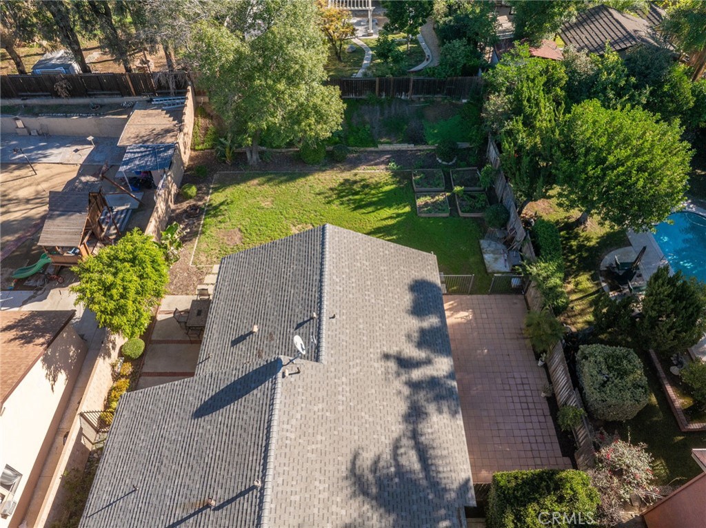 9121 Helms Avenue Rancho Cucamonga, CA 91730 - Photo 34 of 43 an aerial view of a house with garden space and a patio