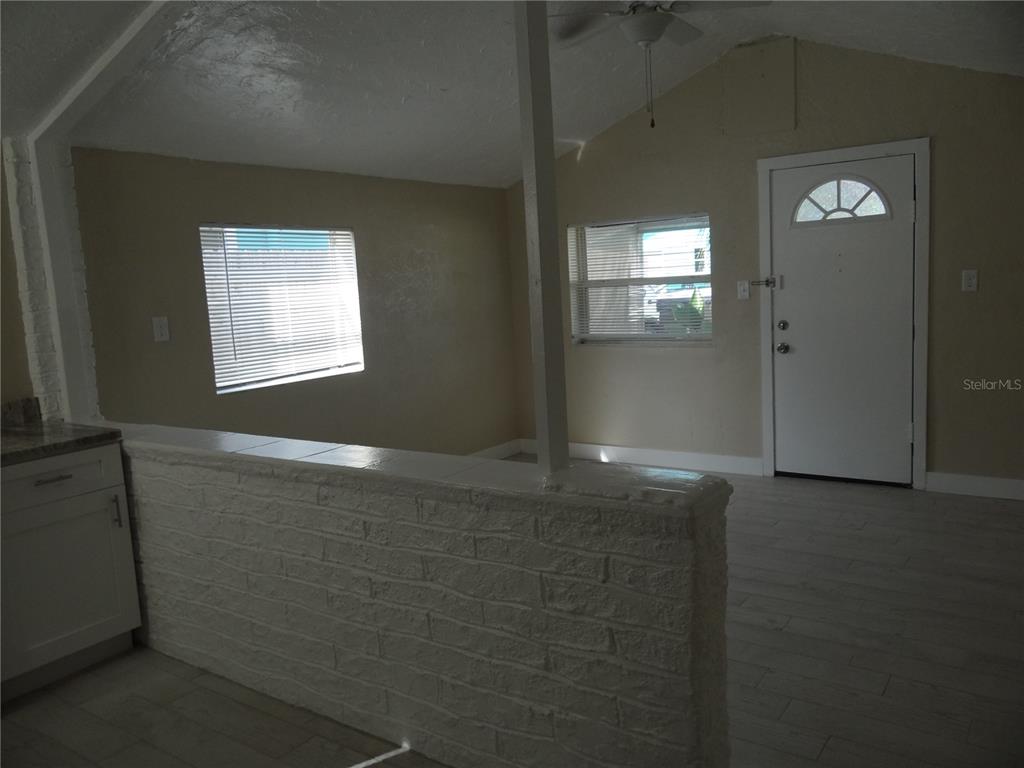 13360 Boca Ciega Avenue Madeira Beach, FL 33708 - Photo 13 of 45 an empty room with windows