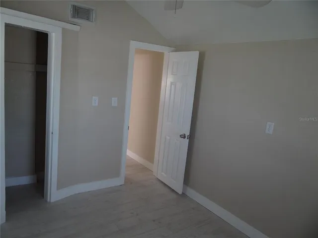 a view of hallway with closet