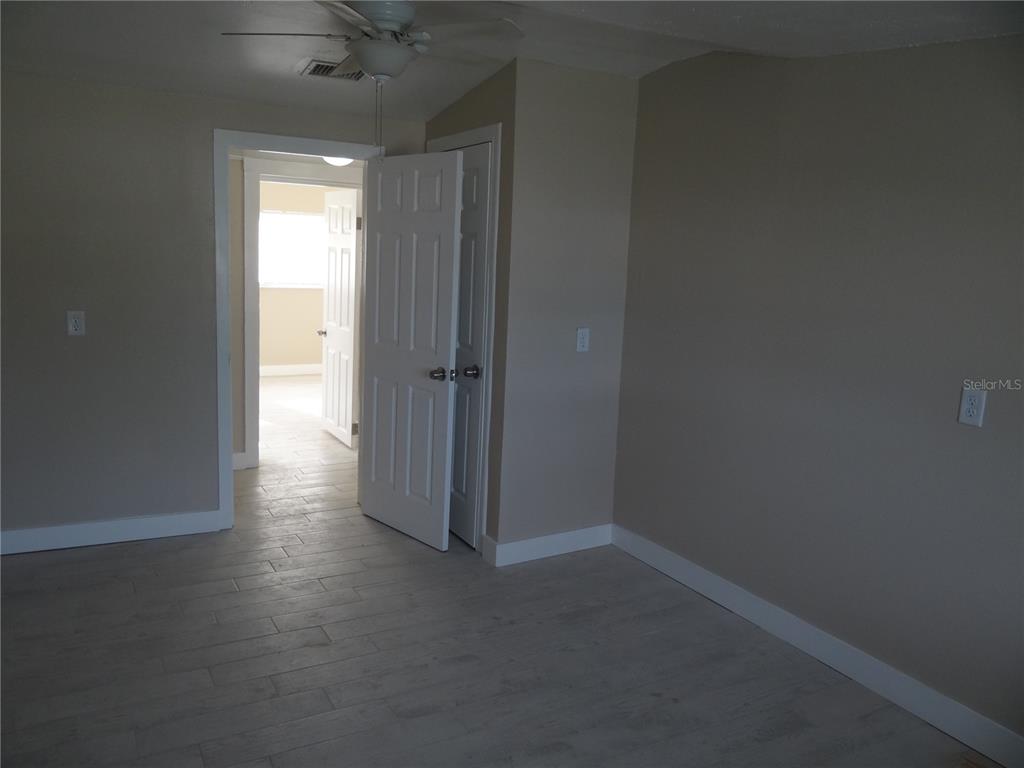 13360 Boca Ciega Avenue Madeira Beach, FL 33708 - Photo 19 of 45 an empty room with a empty space and a window