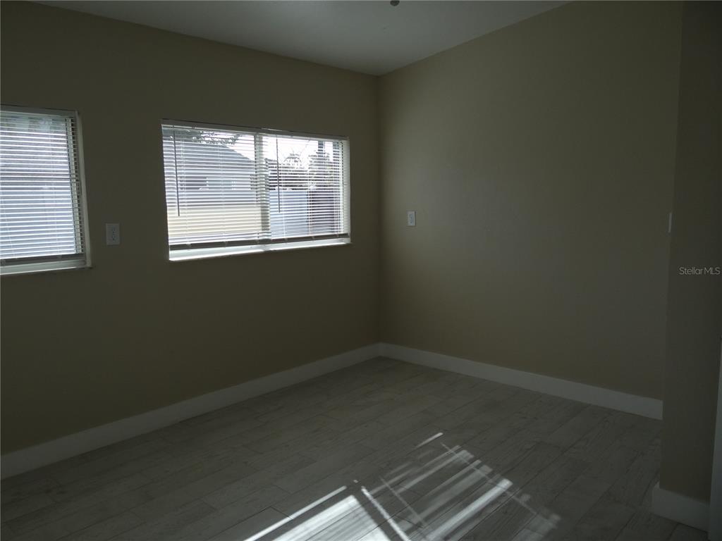 13360 Boca Ciega Avenue Madeira Beach, FL 33708 - Photo 20 of 45 an empty room with a window