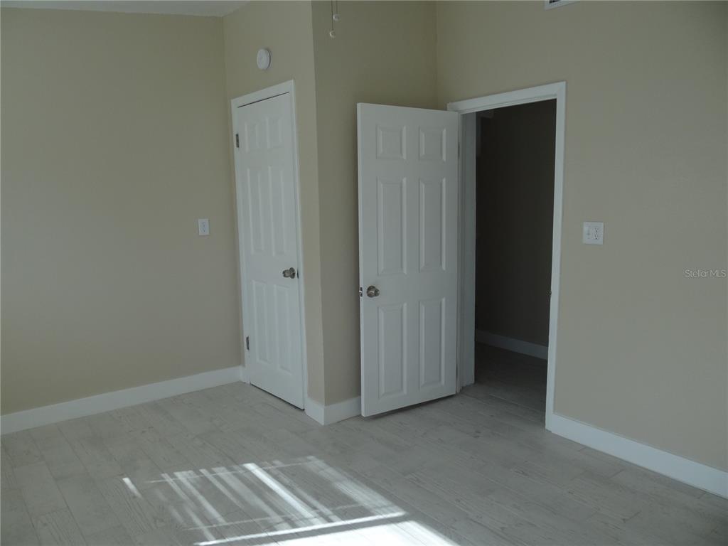 13360 Boca Ciega Avenue Madeira Beach, FL 33708 - Photo 22 of 45 an empty room with windows
