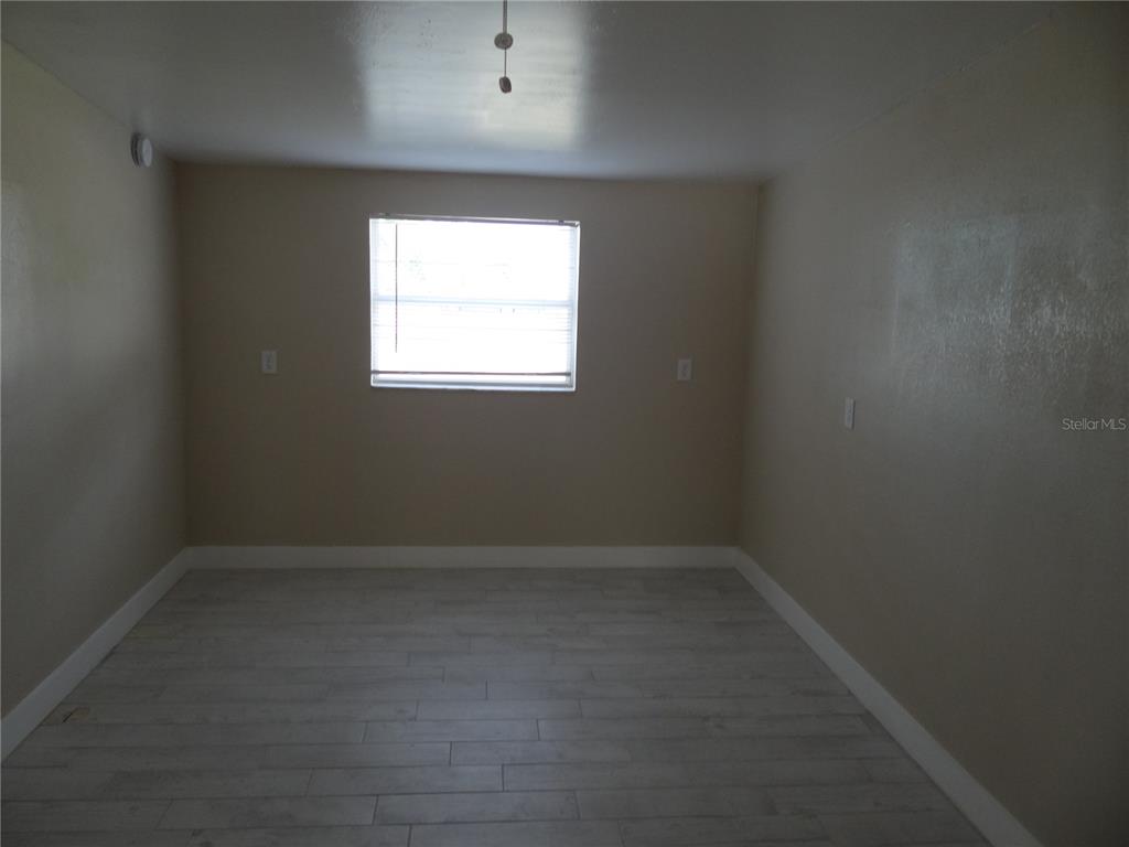 13360 Boca Ciega Avenue Madeira Beach, FL 33708 - Photo 23 of 45 an empty room with a window