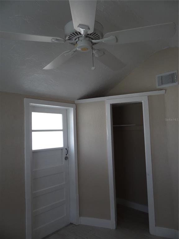13360 Boca Ciega Avenue Madeira Beach, FL 33708 - Photo 26 of 45 an empty room with windows and closet