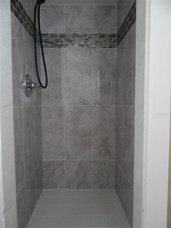 13360 Boca Ciega Avenue Madeira Beach, FL 33708 - Photo 28 of 45 a bathroom with a shower