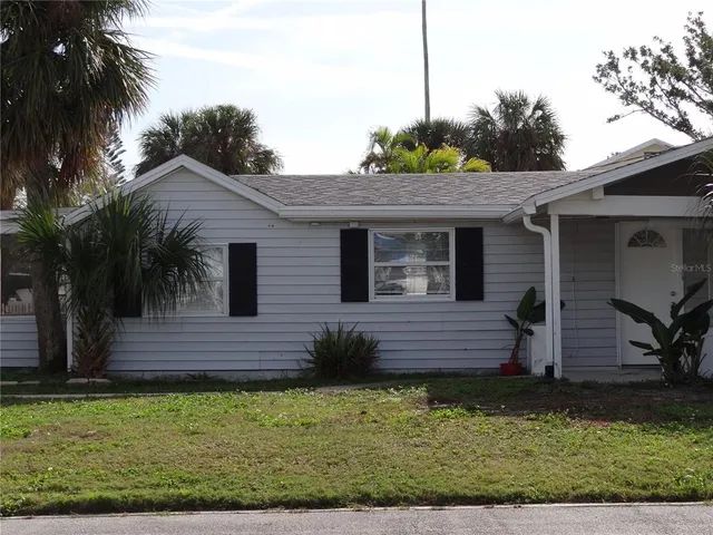 a view of a backyard with a garden and plants