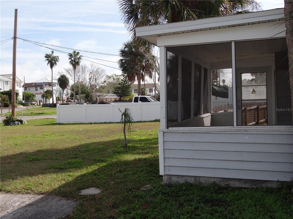 13360 Boca Ciega Avenue Madeira Beach, FL 33708 - Photo 34 of 45 a view of a backyard with a garden and plants