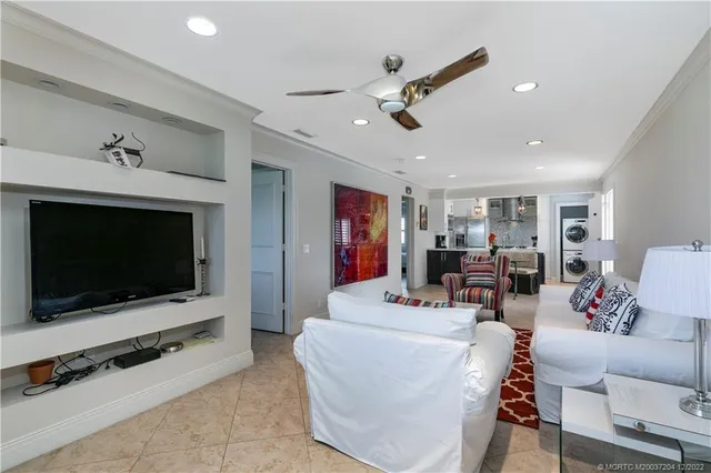 a living room with furniture and a rug