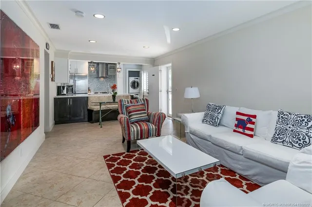 a living room with furniture fireplace and a flat screen tv