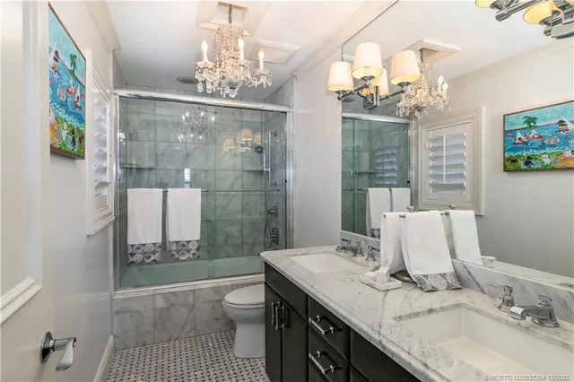 a view of a house with a ocean from a balcony