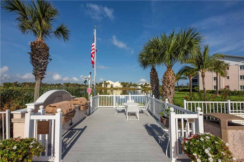 484 Northeast Plantation Road, Unit 4108 Stuart, FL 34996 - Photo 22 of 25 a view of a house with a ocean from a balcony