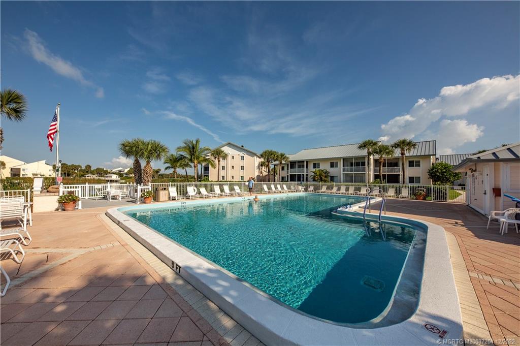 484 Northeast Plantation Road, Unit 4108 Stuart, FL 34996 - Photo 23 of 25 a view of a swimming pool with a patio