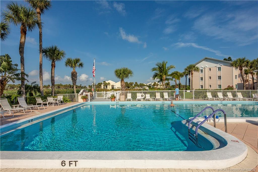 484 Northeast Plantation Road, Unit 4108 Stuart, FL 34996 - Photo 24 of 25 a view of swimming pool with a yard