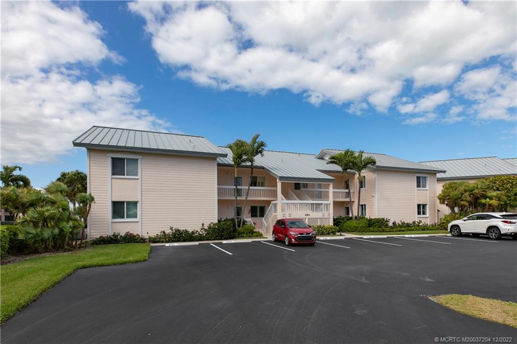 484 Northeast Plantation Road, Unit 4108 Stuart, FL 34996 - Photo 25 of 25 a car parked in front of a house