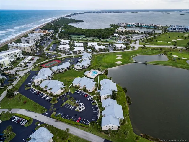 an aerial view of a house with a ocean view