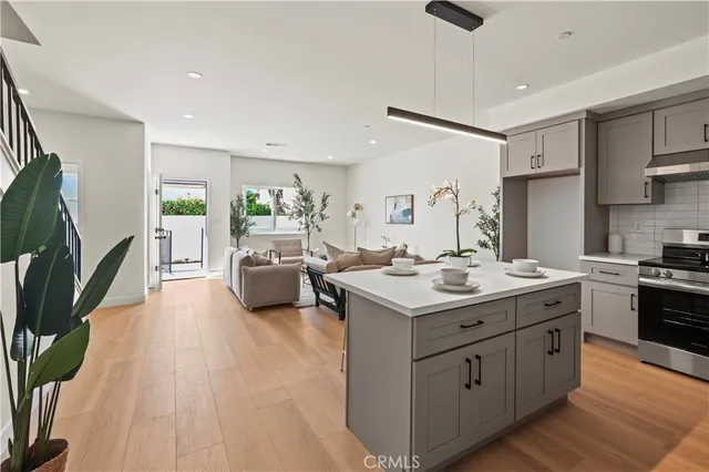 a kitchen with a stove and a refrigerator