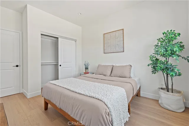 a bedroom with a bed and a chair