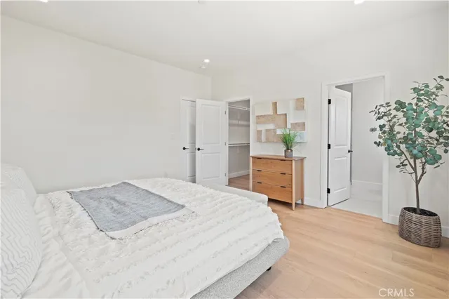 a en suite bathroom with a double vanity sink a mirror and a shower