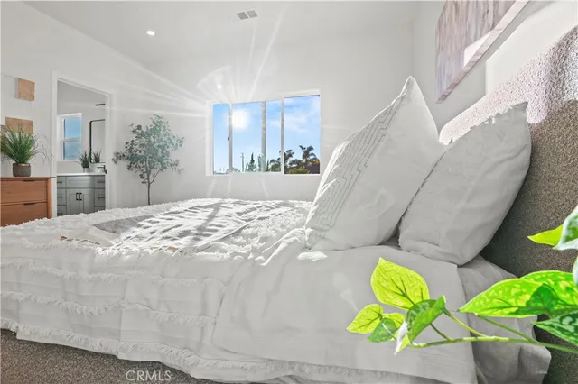 a view of a hallway with wooden floor and furniture