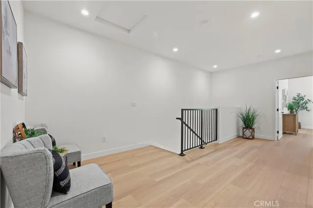 a bathroom with a sink vanity mirror and toilet