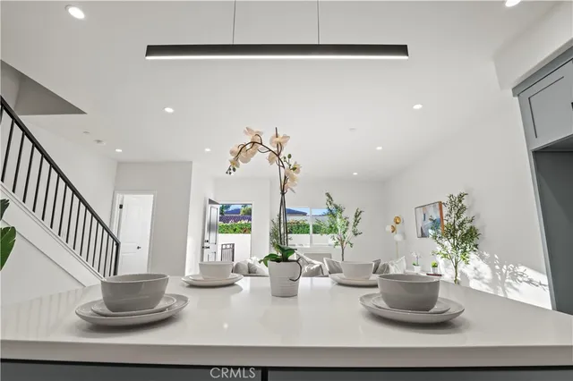 a dining room with table and chairs