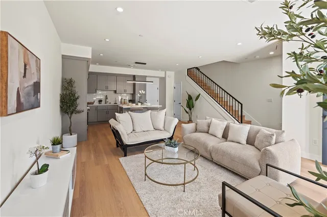 a living room with furniture and a rug