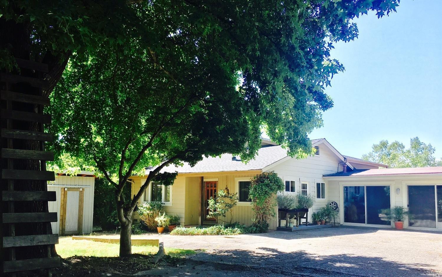 7408 Elphick Road Sebastopol, CA 95472 - Photo 1 of 1 a front view of a house with garden