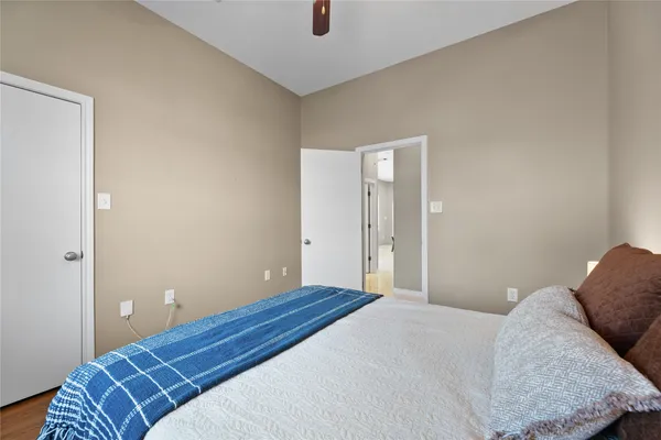 a bedroom with a bed and cabinets