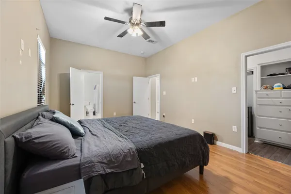 a bedroom with a bed and a dresser