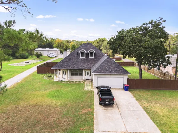 a aerial view of a house with a yard