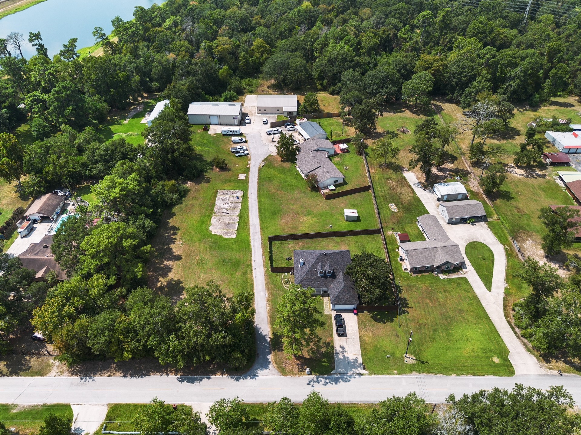 22835 Fritz Lane Spring, TX 77389 - Photo 26 of 26 This fully fenced home is located at the front of a property with another residential home and business warehouse and office.